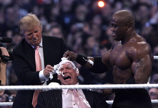 ORG XMIT: *S0419546656* Donald Trump, left, and Bobby Lashley, right shave the head of Vince McMahon after Lashley defeated Umaga at Wrestlemania 23 at Ford Field in Detroit, Sunday, April 1, 2007. (AP Photo/Carlos Osorio) MICO101 04022007xguidelive